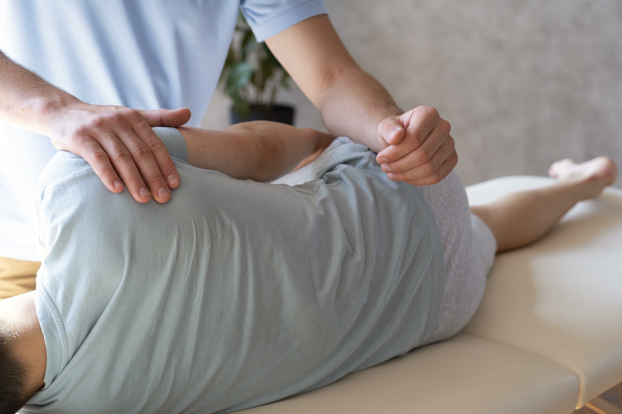 close-up-physiotherapist-helping-patient-with-pain